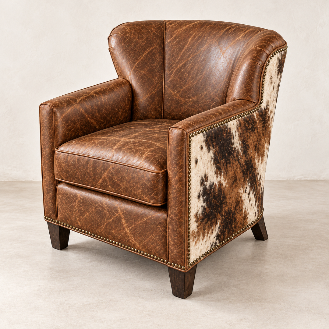 Lottie chair rendered with warm Old West Hacienda leather across the front and tri-color hair-on cowhide wrapping the exterior sides and back, finished with nailhead trim and tapered wooden legs.